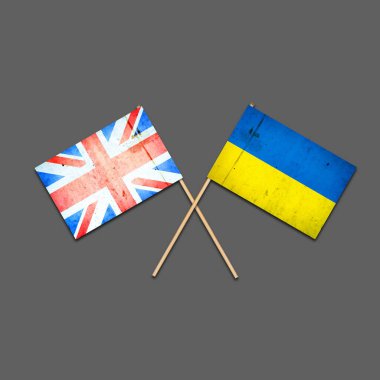 Tahta çubuklarda İngiltere ve Ukrayna bayrakları. Gri bir arka planda izole edilmiş. Uluslararası siyasi ilişkiler. Üç boyutlu illüstrasyon. Bağımsız Devletler. Destek. Siyasi Ekonomik geçmiş. Politika.