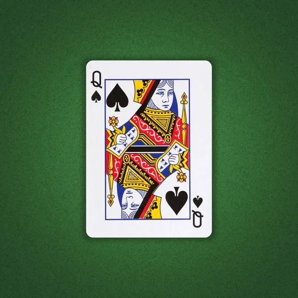 Queen of Spades on a green poker background. Gamble. Playing cards. Background.