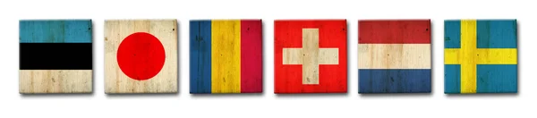 木製のブロックにセット エストニア ルーマニア スイス オランダ スウェーデンの旗 白い背景に隔離されている 記号と記号フラグ — ストック写真