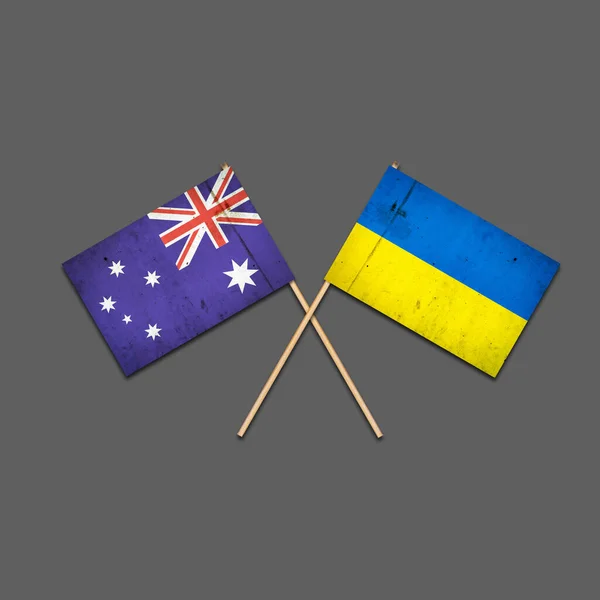 호주와 우크라이나 국기가 막대기 놓여져 있습니다 배경에 고립되어 있습니다 영연방 — 스톡 사진