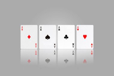 Four Ace. Playing cards on a gray background. Reflection. Gambling. Background.
