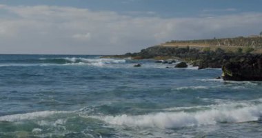 Puerto de la Santiago, Tenerife. Punta Blanca or Punta Juanita - best place to surf or chill relax. Black rocky volcanic beach. Coast of the Atlantic Ocean