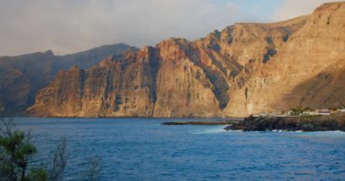 Los Gigantes cliffs. Sunset on Tenerife, Canary Islands, Spain. Volcanic rocky seaside resort in the Canary Islands. Nobody.