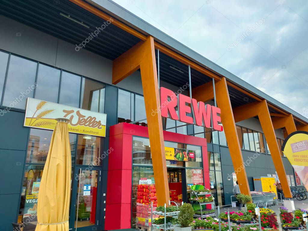 Frankfurt am Main, Germany - April 21, 2022: REWE supermarket. The REWE Group is a German diversified retail and tourism co-operative group based in Cologne, Germany.