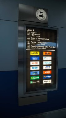 Miami, Florida, USA - November 29, 2019: The people near rental car office at Miami airport at Miami, Florida, USA