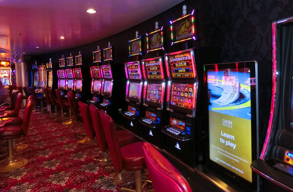 Miami, USA - April 29, 2022: Casino interior, gaming slot machines, American gambling at Symphony of the seas is the biggest cruise ship at Miami, USA on April 29, 2022