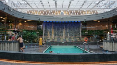 Puerto Plata, Dominican Republic - May 4, 2022: The upper desk swimming pool area on the new cruise ship or new flagship of MSC Seashore, the largest cruise ship built in Italy. clipart