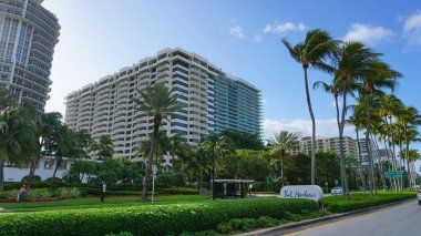 Miami, USA - April 24, 2022: Modern apartment buildings with palm trees at Avenue at Miami, Usa