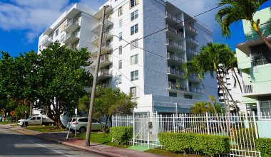 Miami, USA - April 24, 2022: Modern apartment buildings with palm trees at Avenue at Miami, Usa