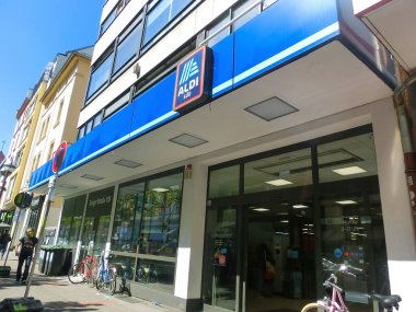 Frankfurt am Main, Germany - May 10, 2022: The frontage and brand logo of a branch of German discount retailer Aldi