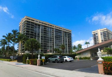 Miami, USA - April 24, 2022: Modern apartment buildings with palm trees at Avenue at Miami, Usa