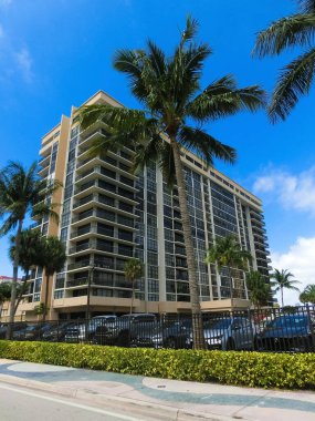 Miami, USA - April 24, 2022: Modern apartment buildings with palm trees at Avenue at Miami, Usa