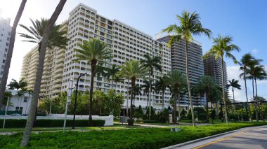 Miami, USA - April 24, 2022: Modern apartment buildings with palm trees at Avenue at Miami, Usa