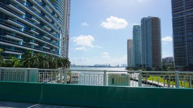 Miami, USA - April 24, 2022: Modern apartment buildings with palm trees at Avenue at Miami, Usa