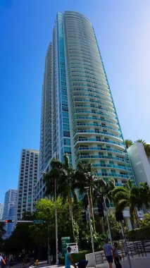 Miami, USA - April 24, 2022: Modern apartment buildings with palm trees at Avenue at Miami, Usa