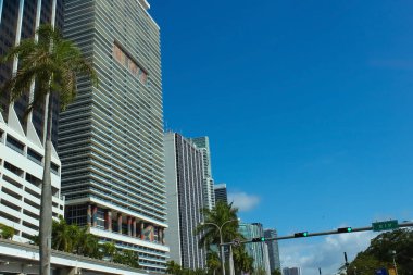 Miami, USA - April 23, 2022: Downtown Miami cityscape view with condos and office buildings against blue sky.