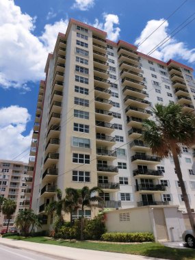 Miami, USA - April 24, 2022: Modern apartment buildings with palm trees at Avenue at Miami, Usa