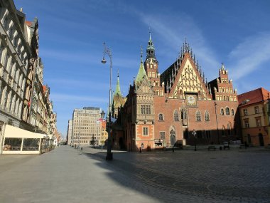 The old town hall building with a clock in the center of Wroclaw Square at Poland
