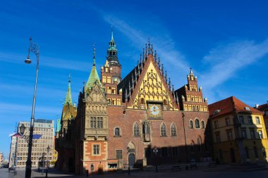The old town hall building with a clock in the center of Wroclaw Square at Poland
