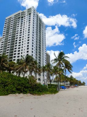 Modern apartment buildings with palm trees at beach at Miami, Usa