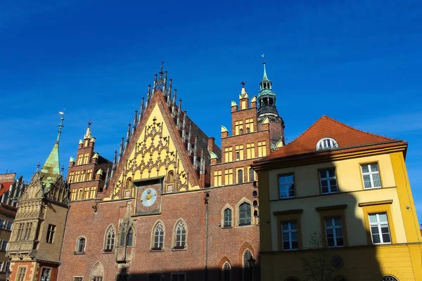 The old town hall building with a clock in the center of Wroclaw Square at Poland