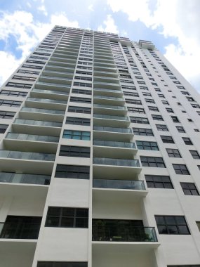 Modern apartment buildings with palm trees at beach at Miami, Usa