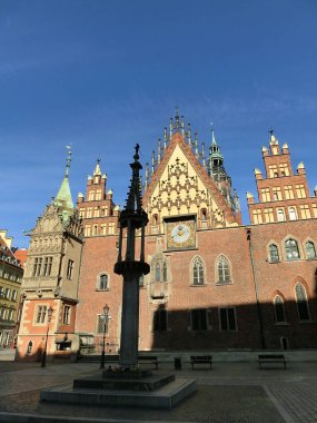 The old town hall building with a clock in the center of Wroclaw Square at Poland