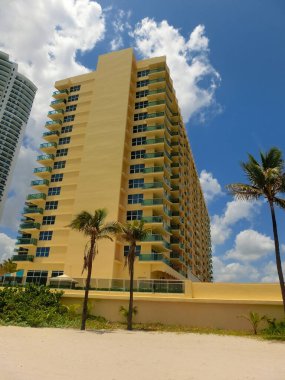 Modern apartment buildings with palm trees at beach at Miami, Usa