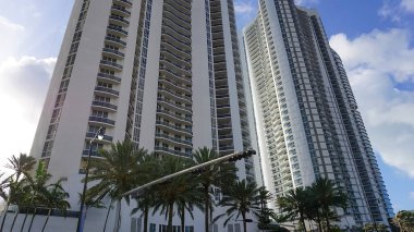 Modern apartment buildings with palm trees at Avenue at Miami, Usa