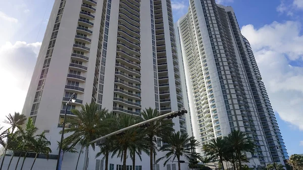 Modern apartment buildings with palm trees at Avenue at Miami, Usa