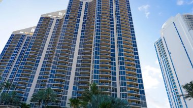 Modern apartment buildings with palm trees at Avenue at Miami, Usa