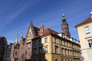 The old town hall building with a clock in the center of Wroclaw Square at Poland