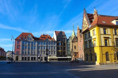 The old town hall building with a clock in the center of Wroclaw Square at Poland