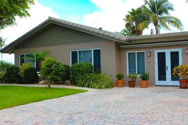 Lauderdale-By-The-Sea, Florida, USA - Typical apartment or hotel at beach in Florida. Tropical beach with palms at USA.