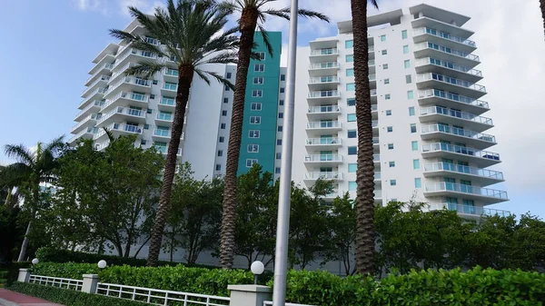 Modern apartment buildings with palm trees at Avenue at Miami, Usa