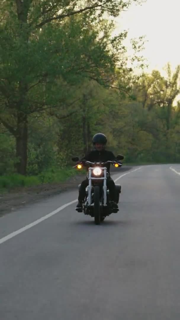 Vertical Screen: Biker riding motorcycle in slow motion — Stock video