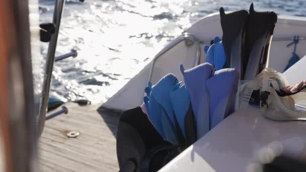 Flippers and diving masks on board of ship — Vídeos de Stock