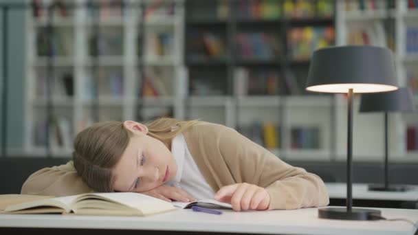 Sad School Girl Lying Book Entertaining Herself Playing Pen Pupil — Stock videók