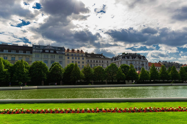 31 May 2019 Vienna, Austria - Belvedere palace`s lake on a cloudy day