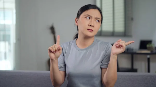 Asian Woman Feel Confused Shrugging Pointing Sitting Living Room Home — 스톡 사진
