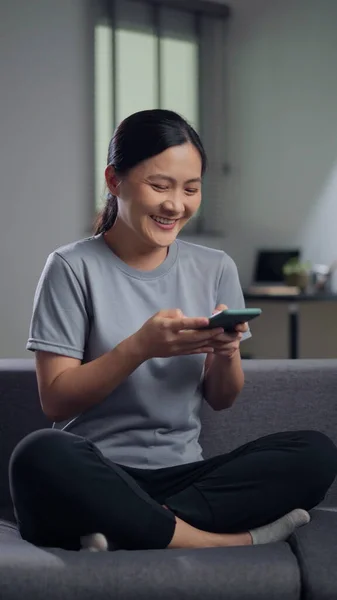 Asian Woman Sitting Sofa Holding Smart Phone Home Happy Woman — Foto de Stock