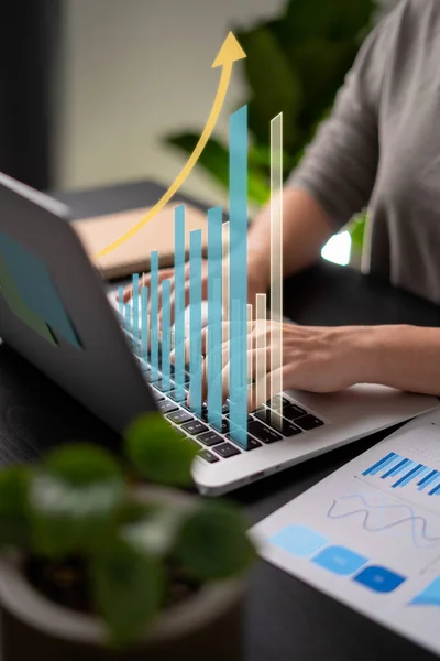 Close up shot of females hands typing message for plan business growth on laptop at home office.