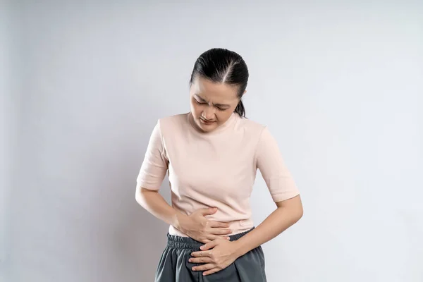 Asian Woman Sick Stomach Ache Putting Her Hands Her Belly — Stok fotoğraf