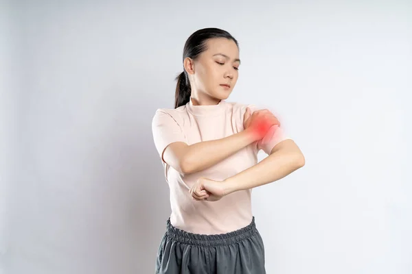 Asian woman was sick and pain touching her body with red spot , standing isolated on white background.