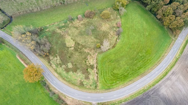 Autumn road near the corn field. Aerial view, drone shot. — Stock Photo, Image