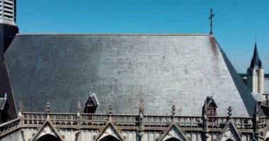 MECHELEN, Malines, Antwerp, BELGIUM, May 16, 2022, Detail of the tower facade and roof of St. Rumbolds cathedral seen from the south from above, aerial drone view, in Mechelen, Belgium. . High