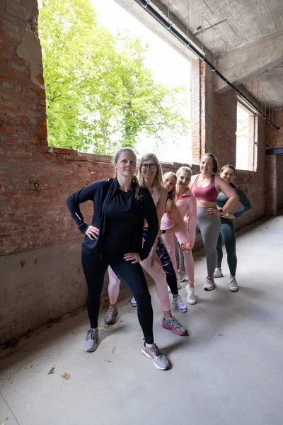 selfie group of female sport team. sporty women wearing sports clothing taking a group photo. influencer and fitness vlogger. High quality photo
