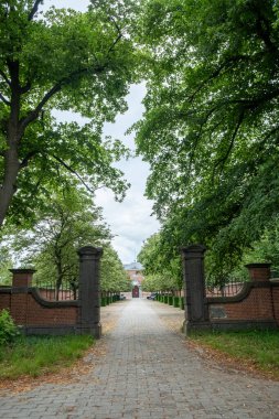 June 25th, 2022, Westmalle, Belgium, view of the wall and entrance gate of the abbey of Westmalle, famous for its blonde, brown and trippel trappist beer. High quality photo