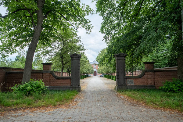 June 25th, 2022, Westmalle, Belgium, view of the wall and entrance gate of the abbey of Westmalle, famous for its blonde, brown and trippel trappist beer. High quality photo