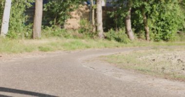 Close up of female legs running on field road outdoors at dawn in summer, concept of healthy running and outdoor exercise. High quality 4k footage